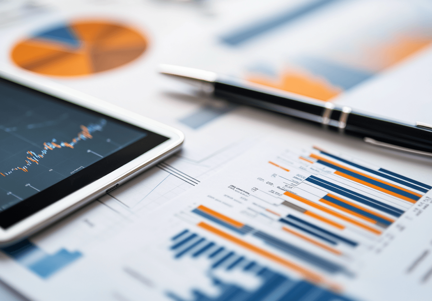 Tablet showing the Signalcraft analytics dashboard beside printed charts