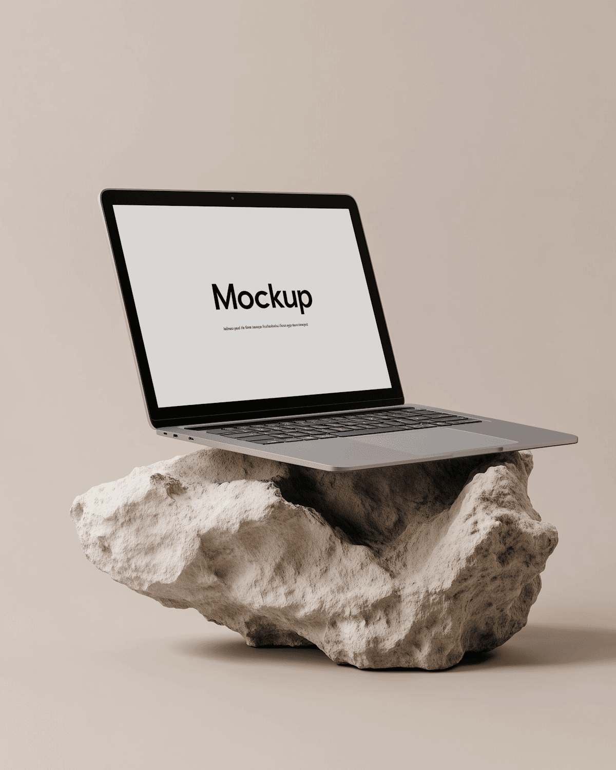 Laptop displaying the Halcyon Pictures website on a textured stone surface